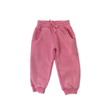 Pink sweatpants on a light gray background